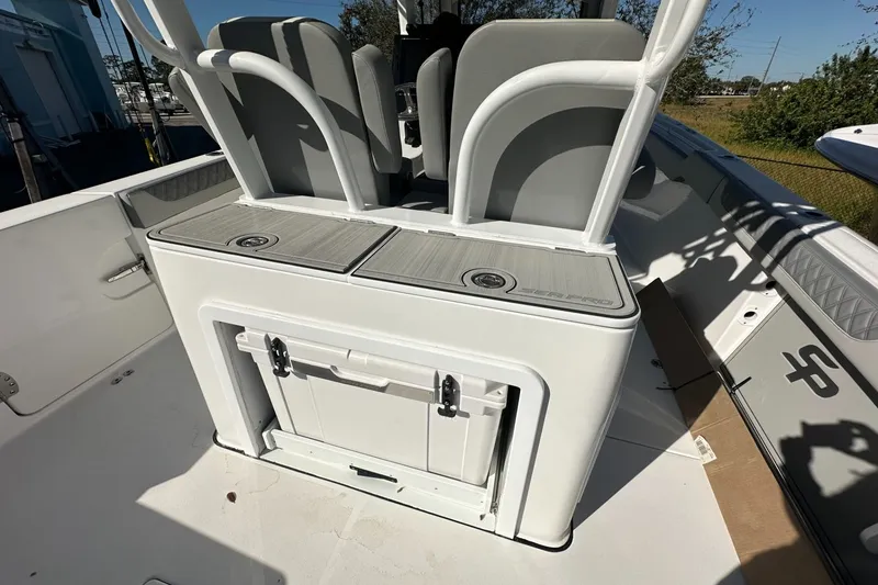 Slide: The Image of 2025 Sea Pro 322 Offshore boat interior with seating and storage compartments. - 18