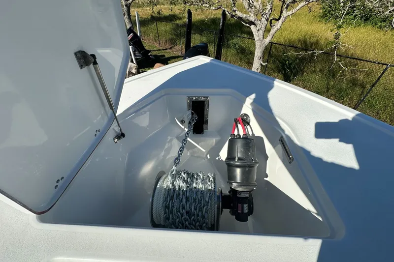 Slide: The Image of Anchor storage compartment of 2025 Sea Pro 322 Offshore boat, featuring chain and winch. - 9
