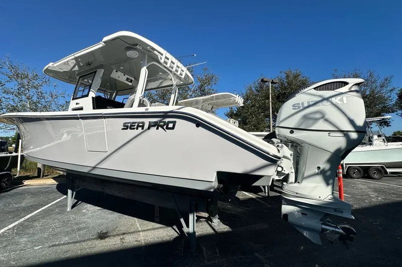 Slide: The Image of 2025 Sea Pro 322 Offshore boat with Suzuki engine, displayed outdoors. - 3