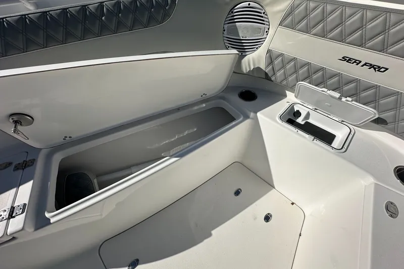 Slide: The Image of Interior view of 2025 Sea Pro 322 Offshore boat with storage compartments. - 12