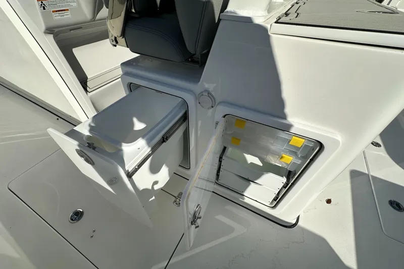 Slide: The Image of 2025 Sea Pro 322 Offshore boat storage compartments with open doors. - 17