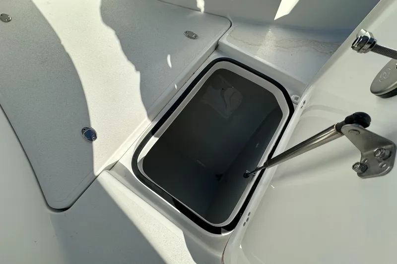 Slide: The Image of Open storage compartment on 2025 Sea Pro 322 Offshore boat deck. - 13