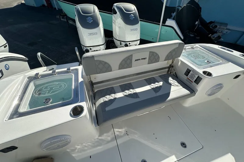 Slide: The Image of 2025 Sea Pro 322 Offshore boat interior with seating and dual Suzuki 350 engines. - 20