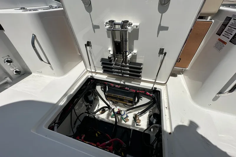 Slide: The Image of Open engine compartment of 2025 Sea Pro 292 Offshore boat, showcasing internal components and wiring. - 15