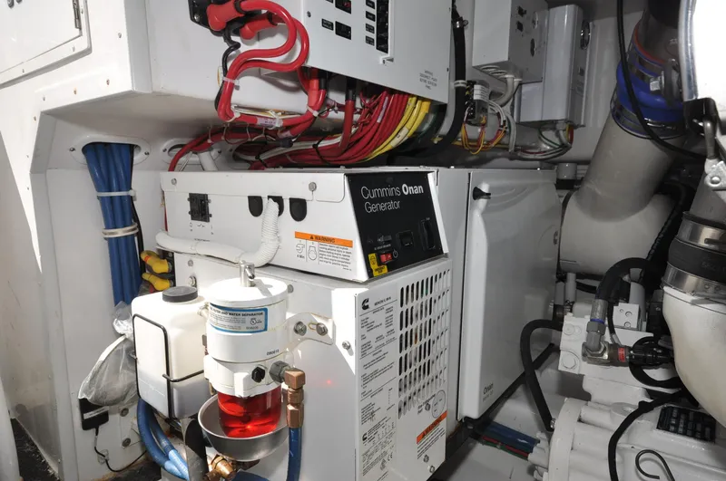 Slide: The Image of Engine room of 2019 Viking 44 Convertible with Cummins Onan generator and wiring. - 21