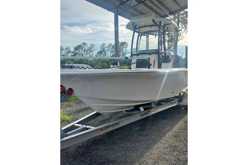 The Image of 2021 Tidewater 2500 Carolina Bay boat on trailer under shelter. - 0