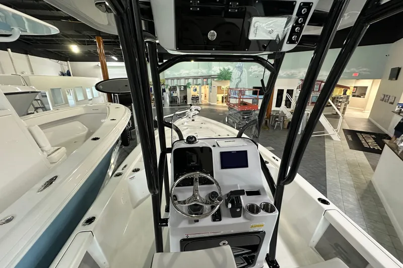 Slide: The Image of Interior view of a 2026 Sea Pro 230 Bay boat in a showroom. - 4