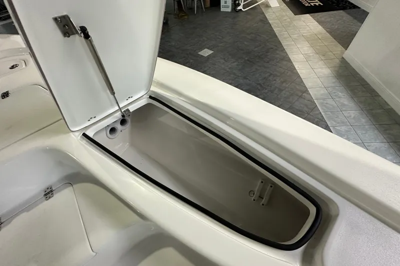 Slide: The Image of Open storage compartment on 2026 Sea Pro 230 Bay boat, showcasing interior design. - 10