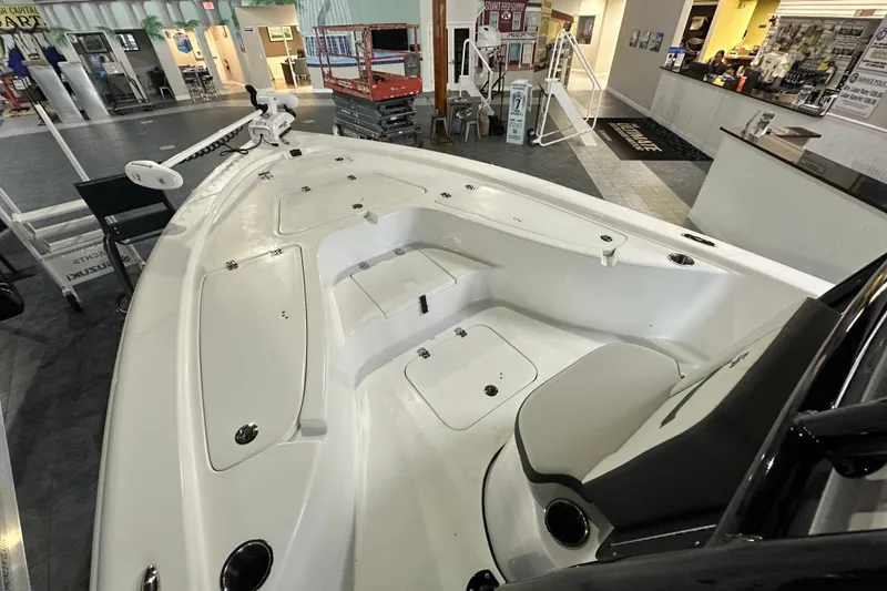 Slide: The Image of 2026 Sea Pro 230 Bay boat interior, showcasing spacious seating and storage compartments. - 7
