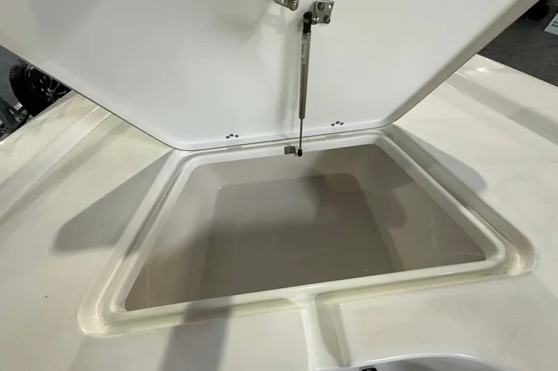 Slide: The Image of Open storage compartment on 2026 Sea Pro 230 Bay boat. - 9