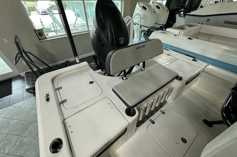 Slide: The Image of 2026 Sea Pro 230 Bay boat interior with seating and storage compartments. - 15