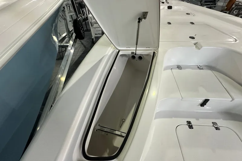 Slide: The Image of 2026 Sea Pro 230 Bay boat storage compartment with open hatch. - 8