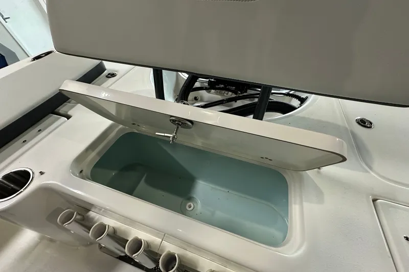 Slide: The Image of Open storage compartment on 2026 Sea Pro 230 Bay boat, showcasing interior features. - 19