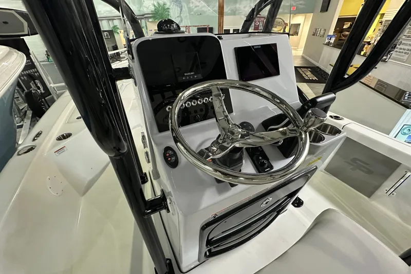 Slide: The Image of 2026 Sea Pro 230 Bay boat console with steering wheel and controls. - 5