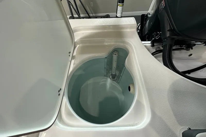 Slide: The Image of Livewell compartment on a 2026 Sea Pro 230 Bay boat, showcasing interior design. - 17
