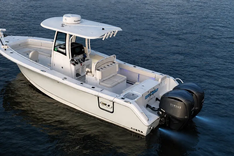 Slide: The Image of 2022 Sea Hunt Gamefish 27FS boat on water with dual Yamaha engines. - 4