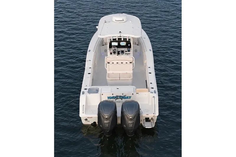 Slide: The Image of 2022 Sea Hunt Gamefish 27FS boat on water, rear view with dual engines. - 18