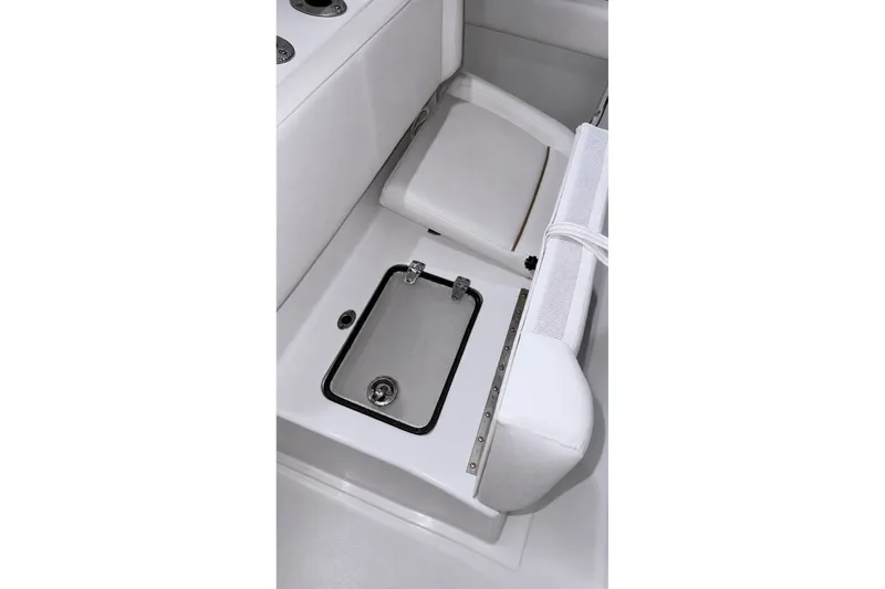 Slide: The Image of 2022 Sea Hunt Gamefish 27FS boat interior with storage compartment and seating. - 27
