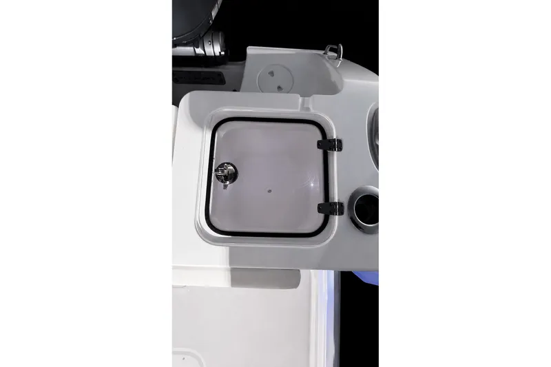 Slide: The Image of 2022 Sea Hunt Gamefish 27FS boat interior with storage compartment and cup holder. - 29