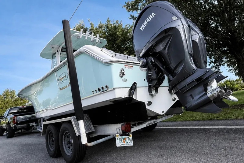 Slide: The Image of 2022 Sea Hunt Gamefish 27FS boat on trailer with Yamaha engine. - 44