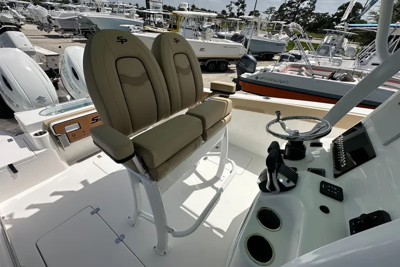 Slide: The Image of 2026 Sea Pro 262 Offshore boat interior with dual seats and steering console. - 9