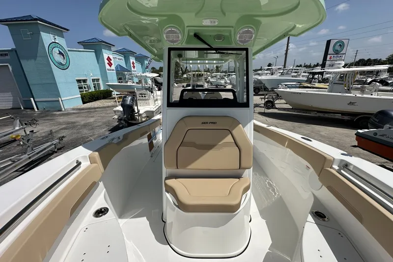 Slide: The Image of 2026 Sea Pro 262 Offshore boat interior with tan seating and modern design. - 7