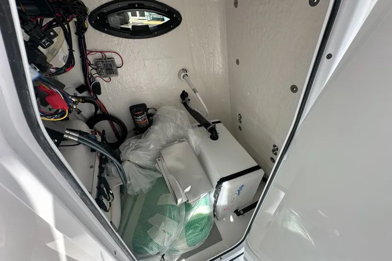 Slide: The Image of Interior view of 2026 Sea Pro 202 Center Console boat's storage compartment. - 7