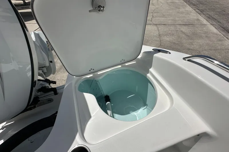Slide: The Image of Open storage compartment on 2026 Sea Pro 202 Center Console boat. - 11