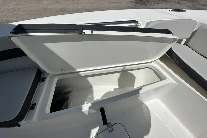 Slide: The Image of Open storage compartment on 2026 Sea Pro 202 Center Console boat. - 6