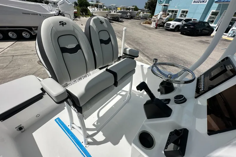 Slide: The Image of 2026 Sea Pro 202 Center Console boat interior with dual seats and steering wheel. - 8