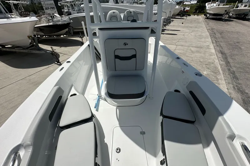 Slide: The Image of 2026 Sea Pro 202 Center Console boat interior with seating and storage compartments. - 4