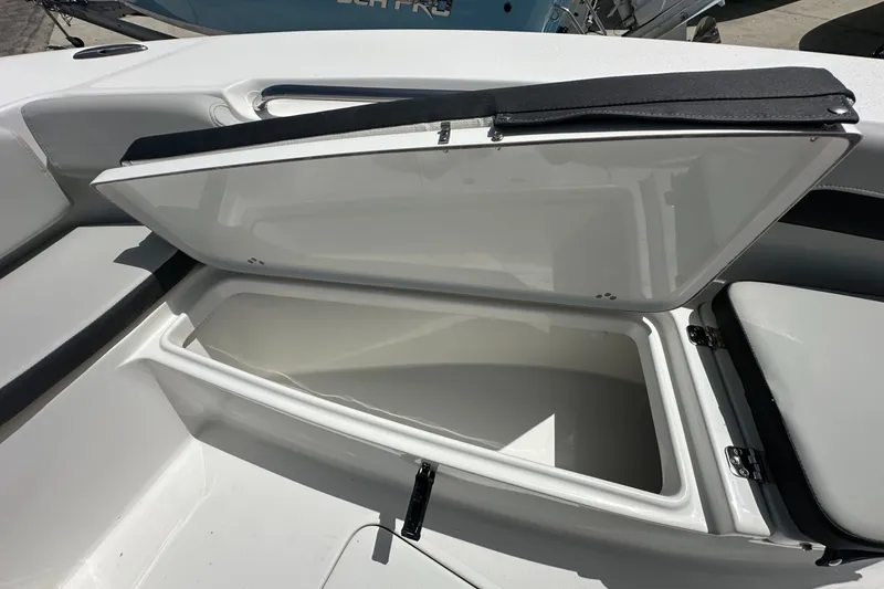 Slide: The Image of Open storage compartment on 2026 Sea Pro 202 Center Console boat. - 5