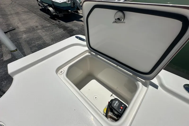 Slide: The Image of Open storage compartment on a 2026 Sea Pro 250 Bay boat. - 12