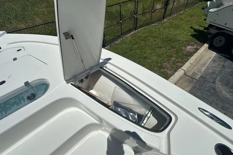 Slide: The Image of Open storage compartment on 2026 Sea Pro 250 Bay boat deck. - 7