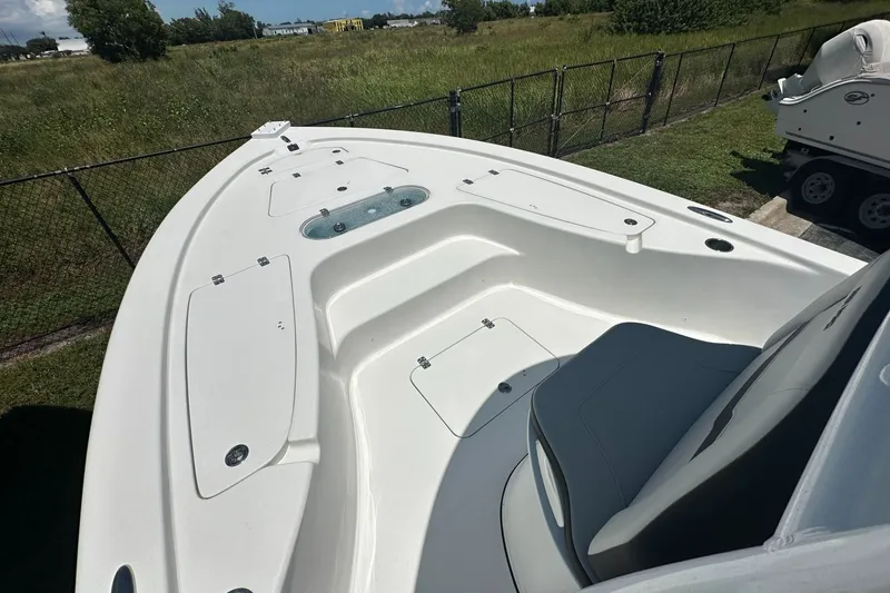 Slide: The Image of 2026 Sea Pro 250 Bay boat deck, spacious seating, and storage compartments. - 4