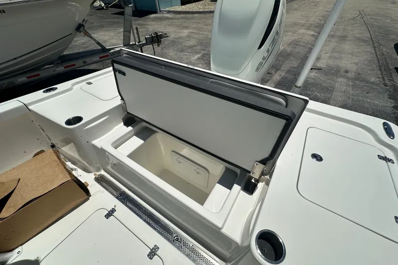 Slide: The Image of Open storage compartment on a 2026 Sea Pro 250 Bay boat deck. - 10