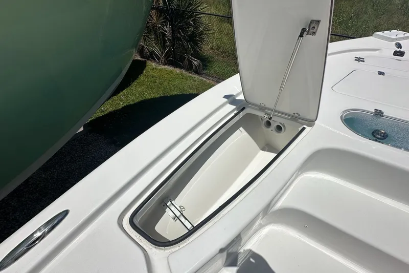 Slide: The Image of Open storage compartment on 2026 Sea Pro 250 Bay boat deck. - 5
