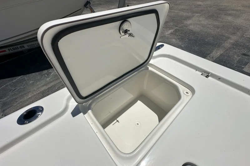 Slide: The Image of Open storage compartment on 2026 Sea Pro 250 Bay boat deck. - 14