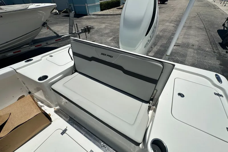 Slide: The Image of 2026 Sea Pro 250 Bay boat interior with seating and storage compartments. - 11
