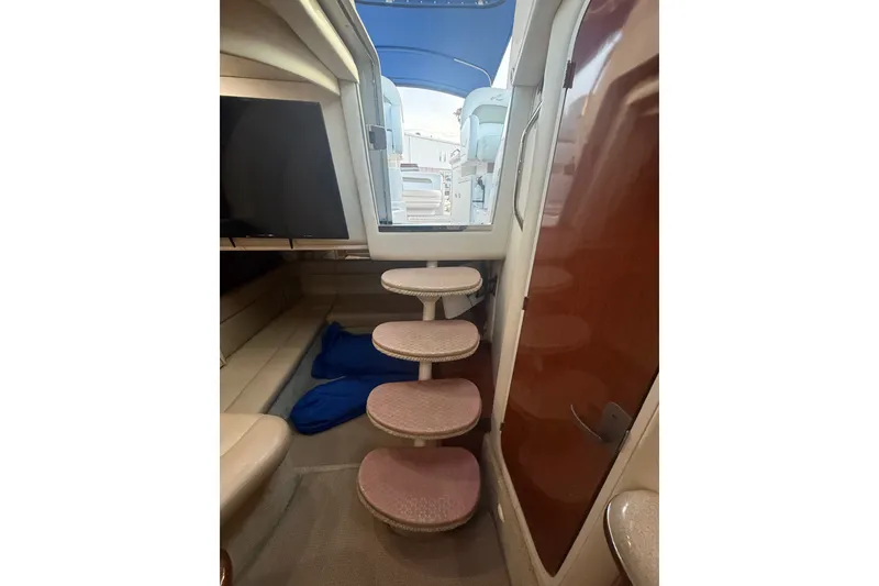 Slide: The Image of Interior view of 2007 Sea Ray 340 Sundancer yacht with steps and seating area. - 26
