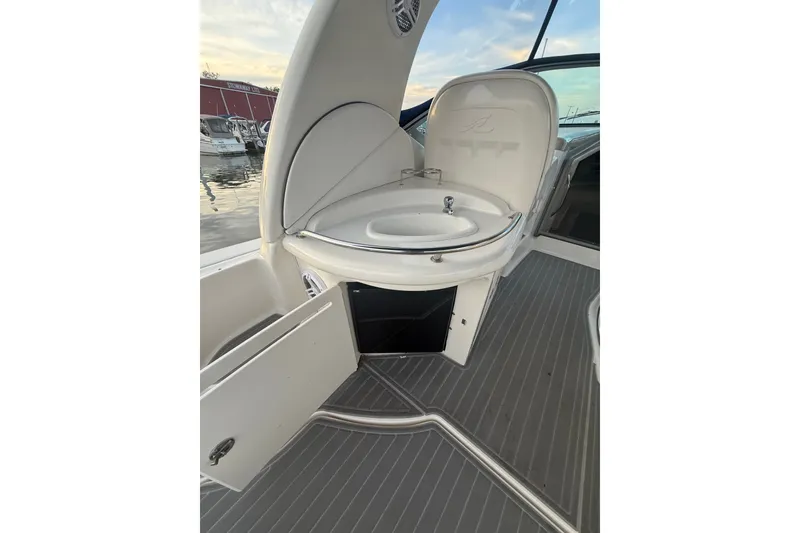 Slide: The Image of 2007 Sea Ray 340 Sundancer boat sink and storage area on deck. - 11