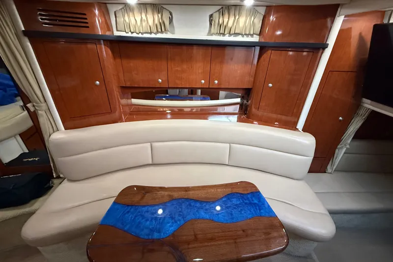Slide: The Image of Luxurious interior of 2007 Sea Ray 340 Sundancer with elegant wood cabinetry and plush seating. - 20
