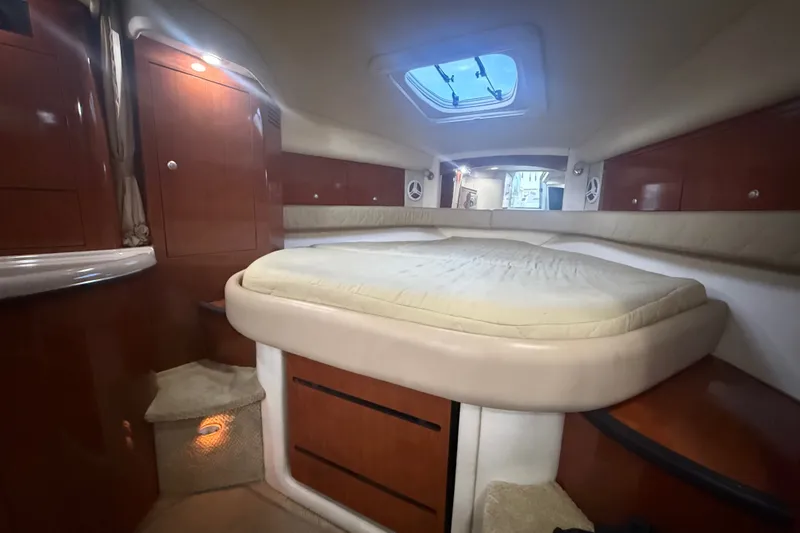 Slide: The Image of Luxurious cabin interior of 2007 Sea Ray 340 Sundancer yacht with cozy bed and wood finish. - 22