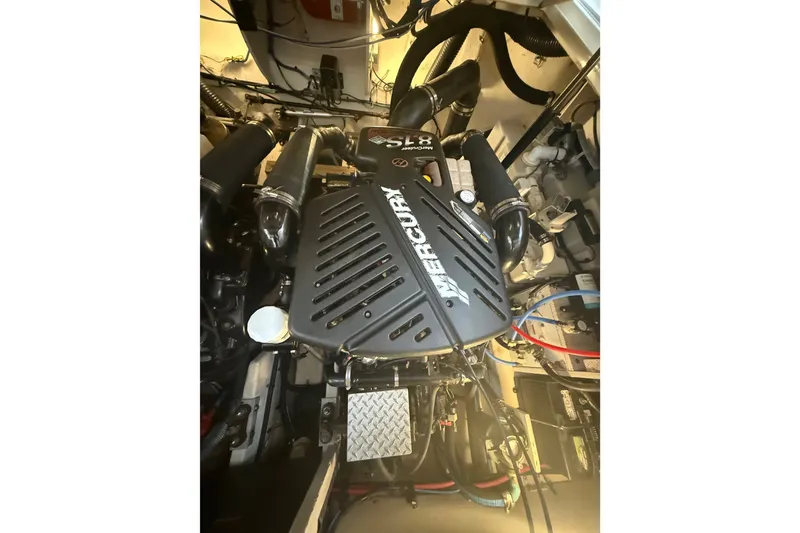 Slide: The Image of Engine compartment of a 2007 Sea Ray 340 Sundancer with Mercury components. - 29