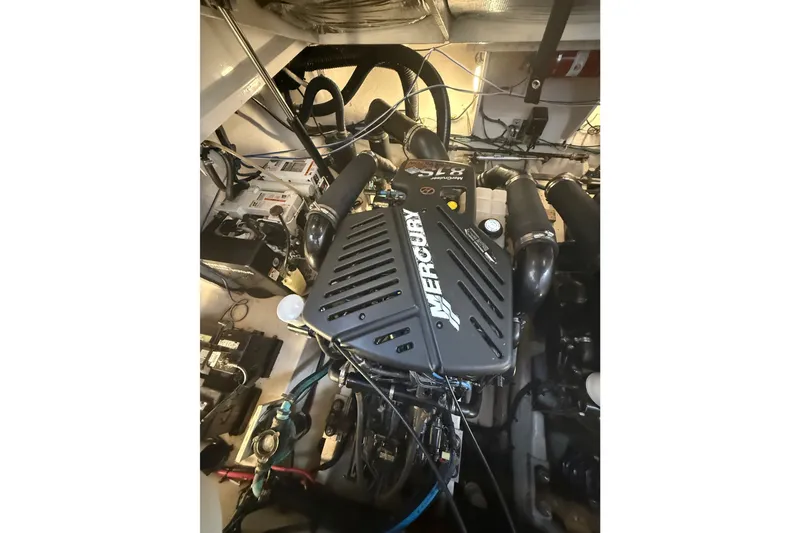 Slide: The Image of Engine compartment of 2007 Sea Ray 340 Sundancer with Mercury engine components. - 30