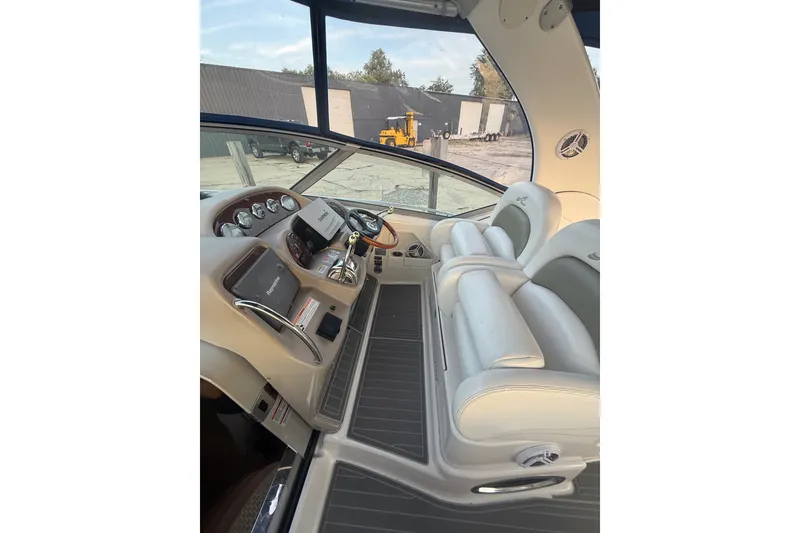 Slide: The Image of 2007 Sea Ray 340 Sundancer helm with modern controls and comfortable seating. - 12