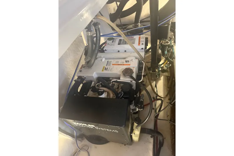 Slide: The Image of Engine compartment of a 2007 Sea Ray 340 Sundancer boat, showcasing mechanical components. - 31