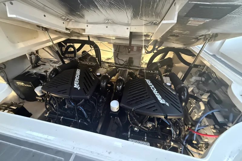 Slide: The Image of Engine compartment of a 2007 Sea Ray 340 Sundancer with twin Mercury engines. - 27
