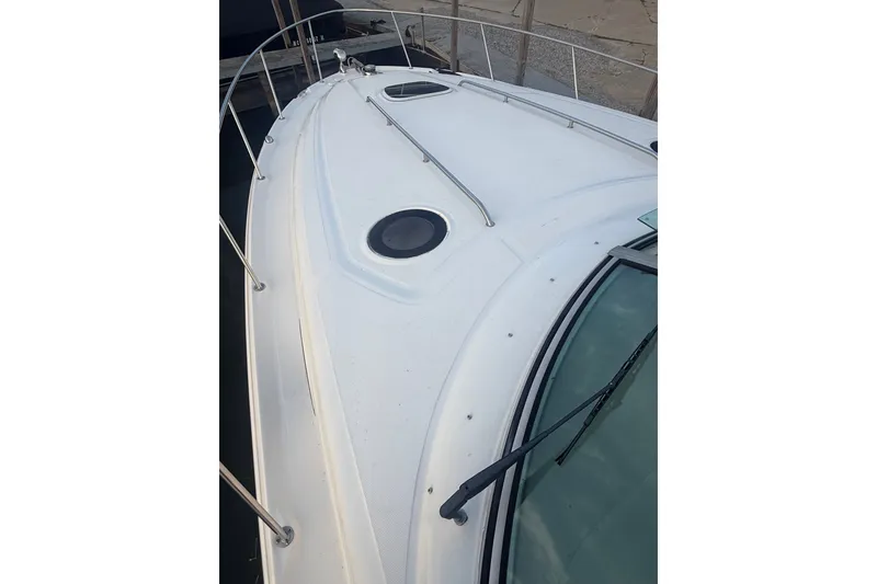 Slide: The Image of 2007 Sea Ray 340 Sundancer boat deck with railing and hatch. - 5