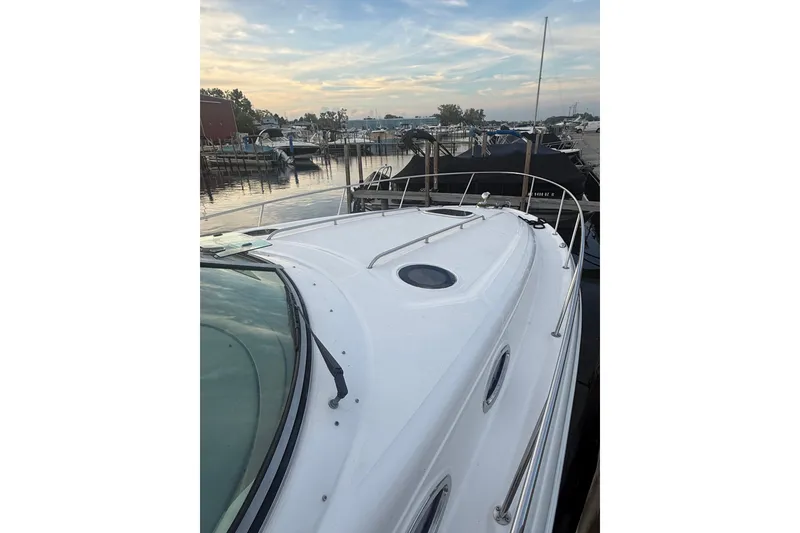 Slide: The Image of 2007 Sea Ray 340 Sundancer yacht docked at marina during sunset. - 4